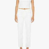 Woman wearing a white sleeveless top and pants on a white background