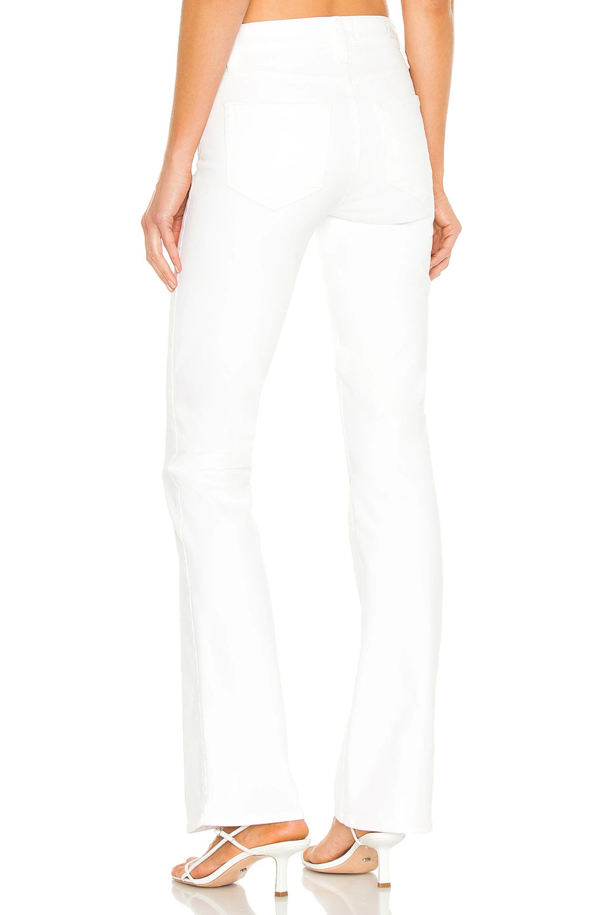 White pants worn by a person on a white background