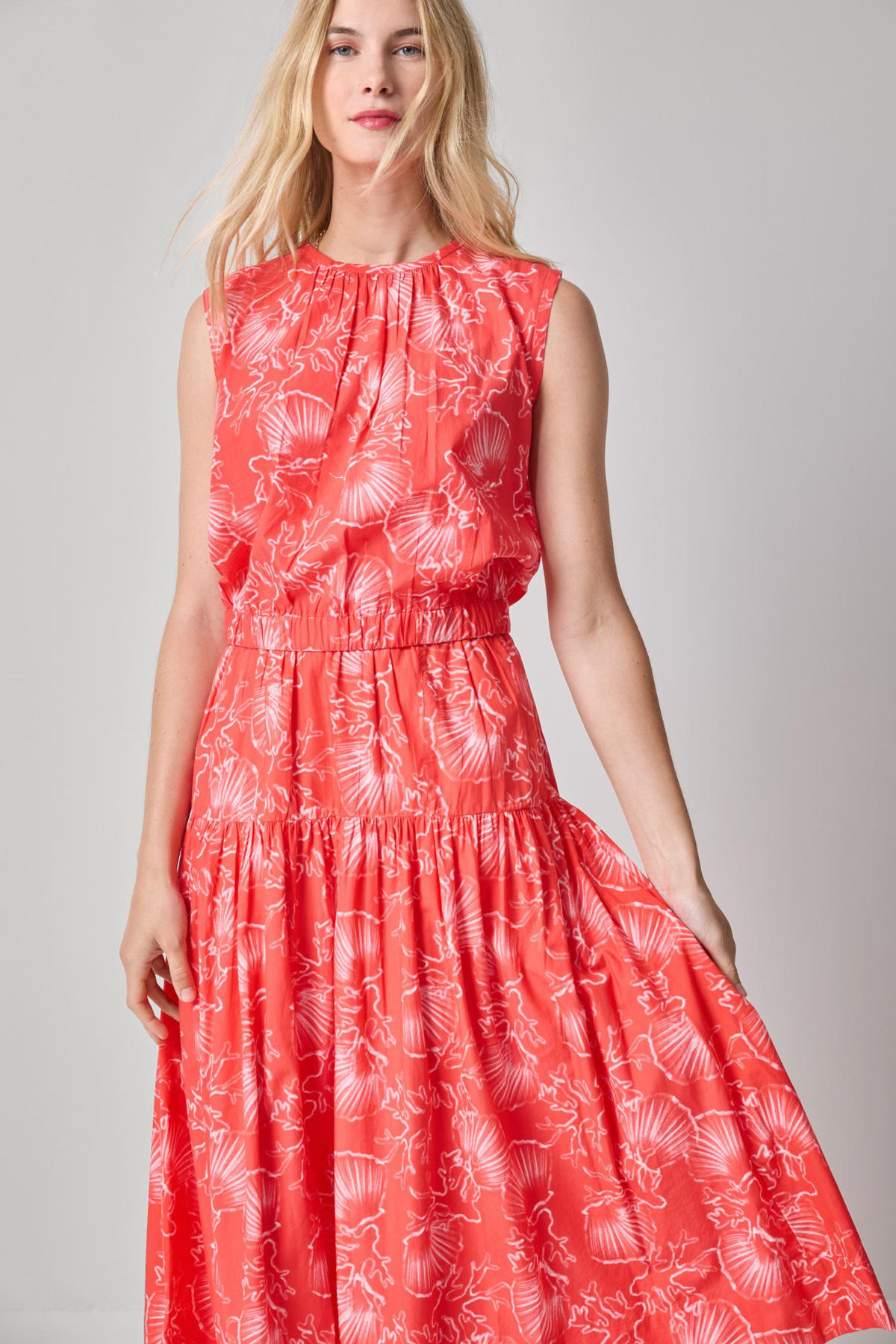 woman in patterned red set on white background 