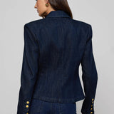 Navy structured blazer styled over a simple top.