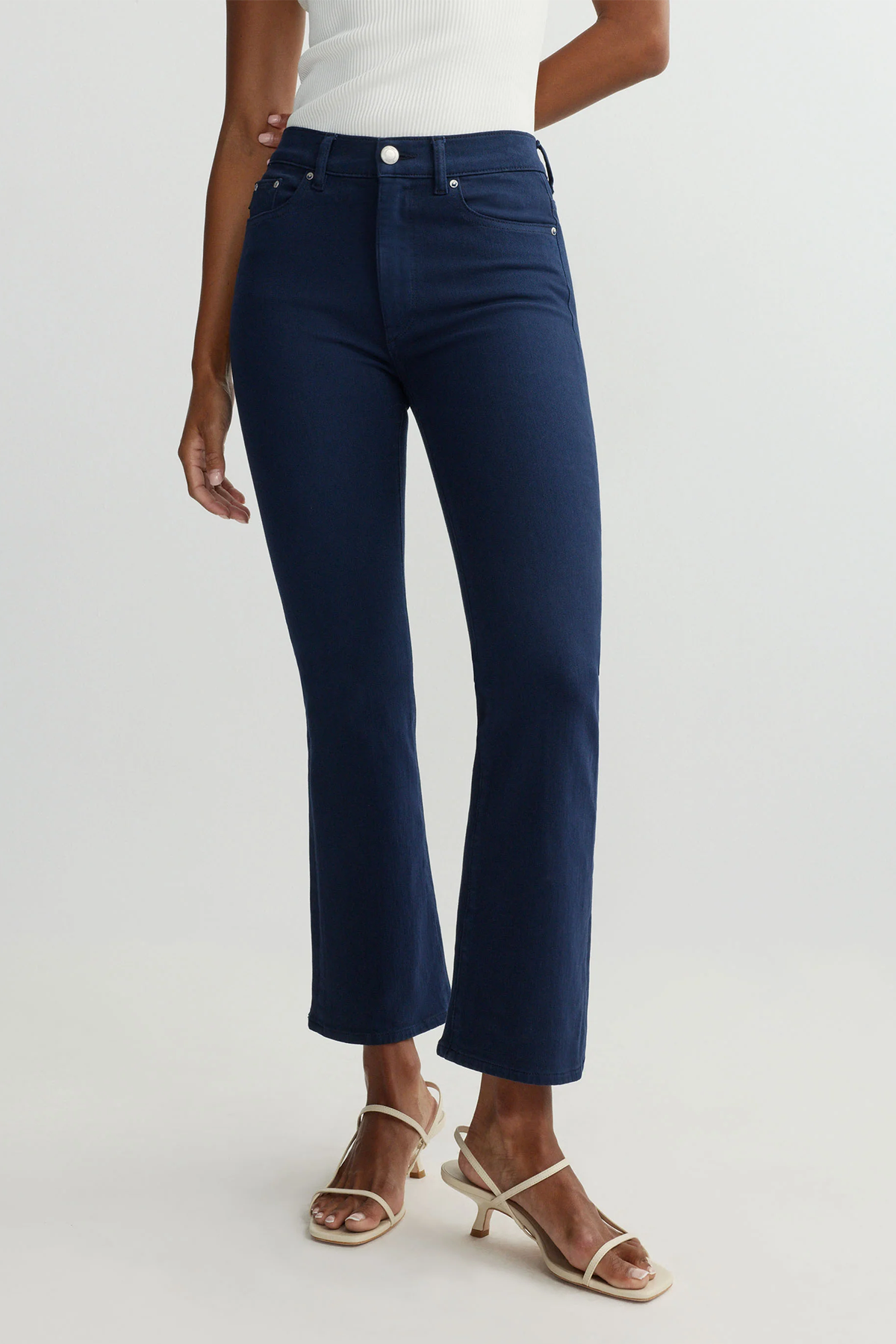 navy pants on woman with white background 