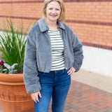 Faux fur zip-up jacket with a plush collar in a neutral tone
