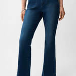 Person wearing blue jeans on a white background