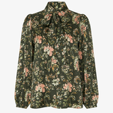 Women's printed style featuring an earthy multicolor pattern and feminine silhouette.