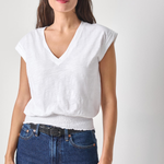 woman in white vneck tee on white background 