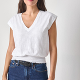 woman in white vneck tee on white background 