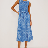 blue smocked printed dress on woman on white background 