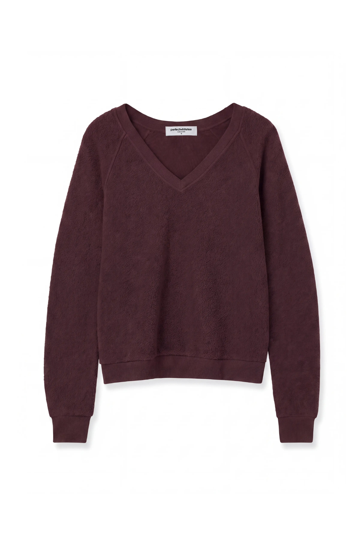 A dark plum purple V-neck knit sweater with long raglan sleeves, shown flat against a plain white background.
