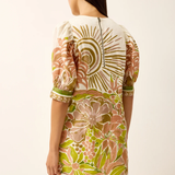 Woman wearing a floral dress with a white background