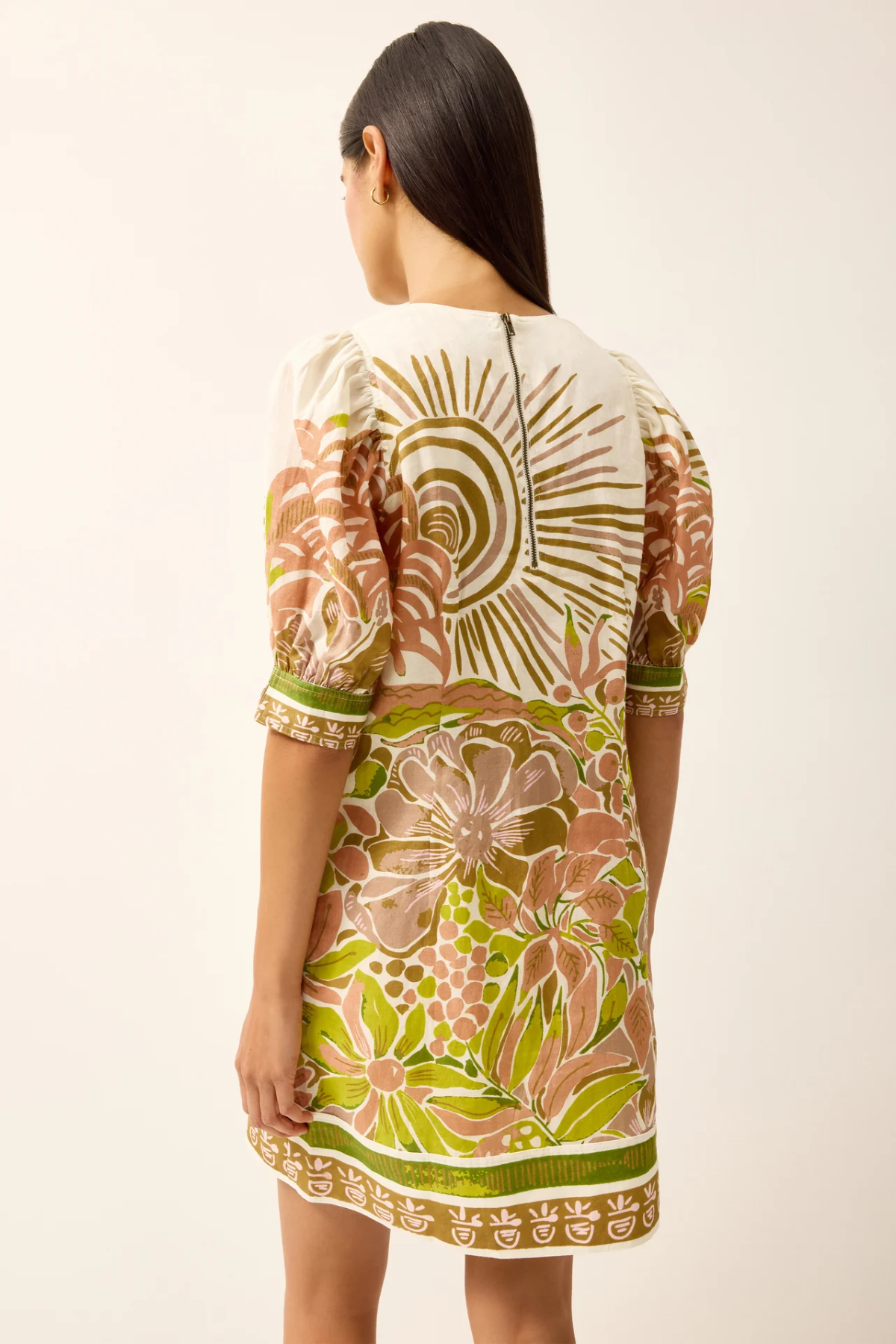 Woman wearing a floral dress with a white background