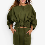 Model wearing a structured jacket with long sleeves and a flattering tailored silhouette.