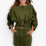 Model wearing a structured jacket with long sleeves and a flattering tailored silhouette.