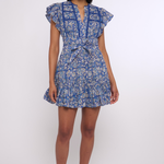 Model wearing a blue printed mini dress with short sleeves and a fitted waist.