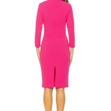 Woman wearing a bright pink dress on a white background