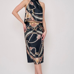 Model wearing a printed midi skirt with a coordinating floral-inspired pattern and flowing silhouette.