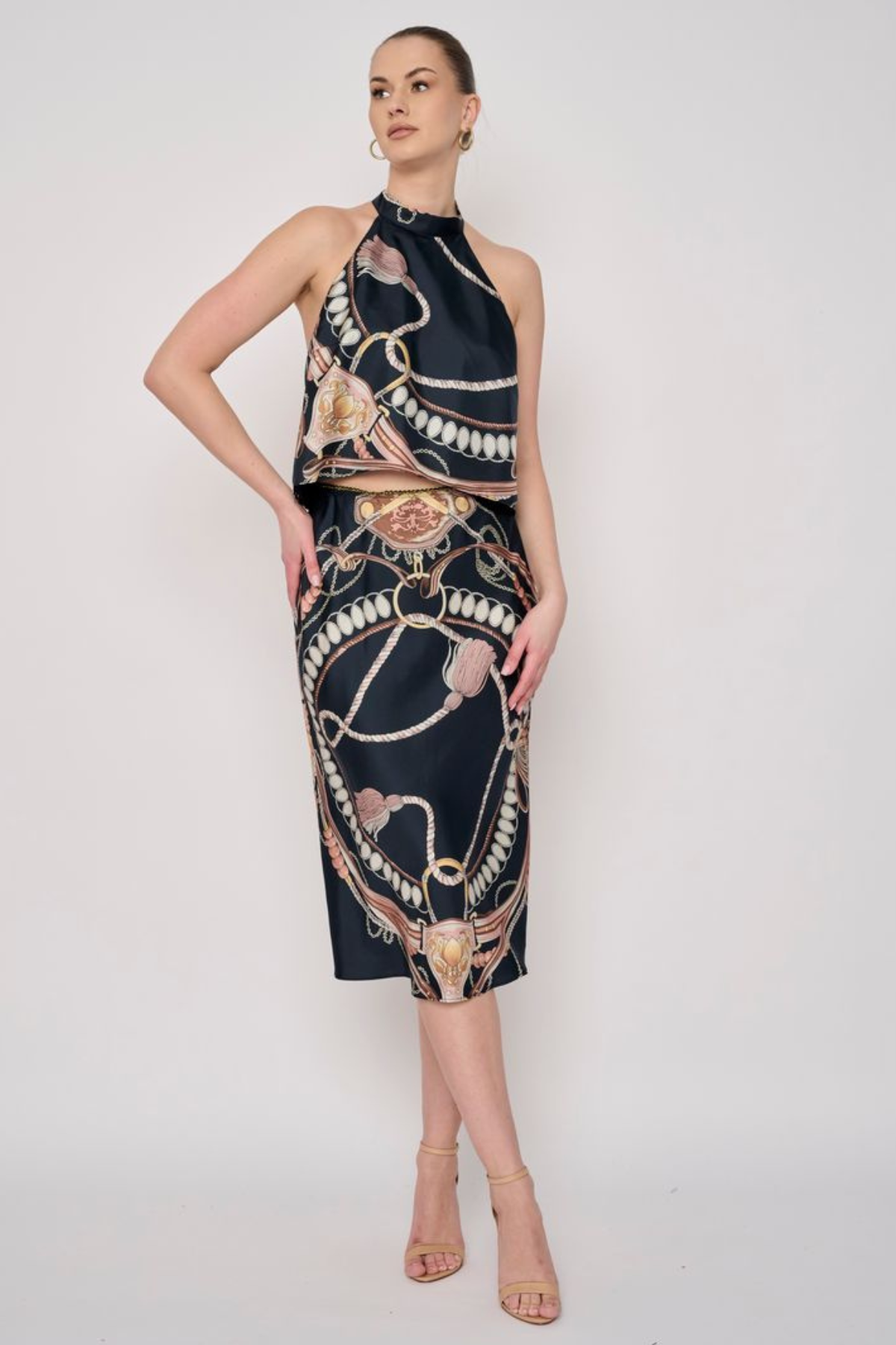 Model wearing a printed midi skirt with a coordinating floral-inspired pattern and flowing silhouette.