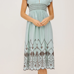 Light blue dress with lace details on a white background