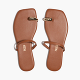 Pair of brown sandals with gold accents on a white background