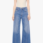 Model wearing light-wash straight-leg denim jeans with a cropped ankle-length silhouette.