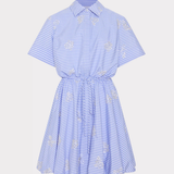 Blue and white striped dress with lace details on a light gray background