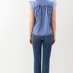 back of woman in jeans and stripe ruffle top