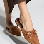Women's flat shoe featuring a sleek, refined silhouette.