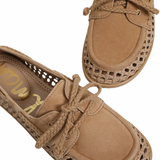 close up womens woven boat shoe on white background 