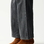 Women's brown textured ankle boot featuring a sleek silhouette and heel.