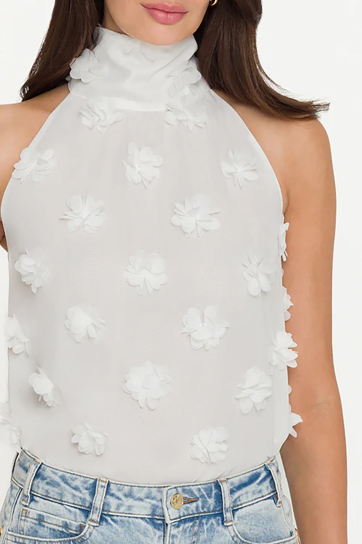 White floral halter top worn by a person on a white background