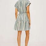 Woman wearing a striped dress on a white background