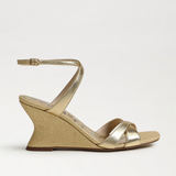 Gold wedge sandal on a white background