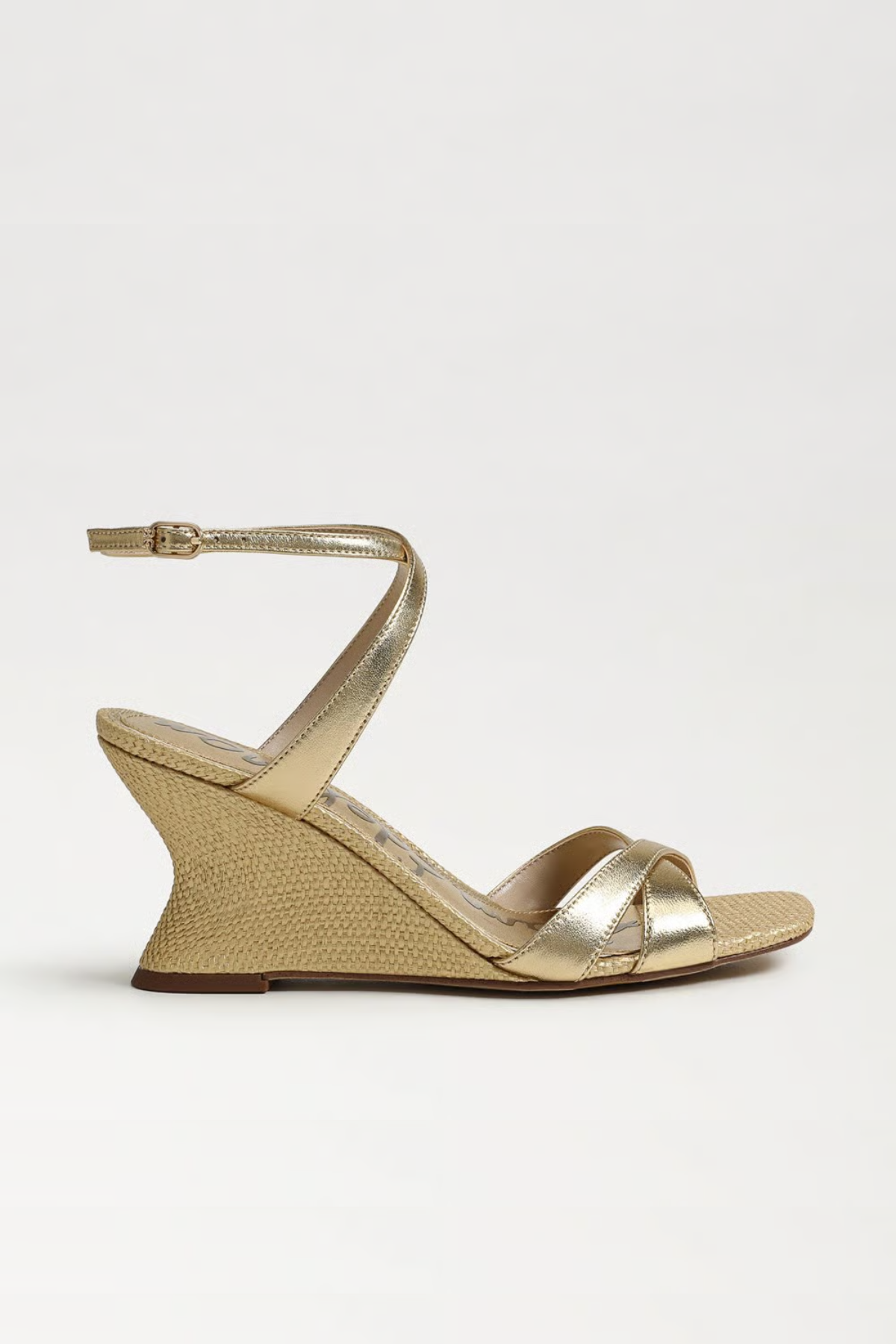 Gold wedge sandal on a white background