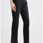A model wearing black cropped straight-leg jeans with a faded wash, paired with black slingback heels, shown from the waist down on a light gray studio background.
