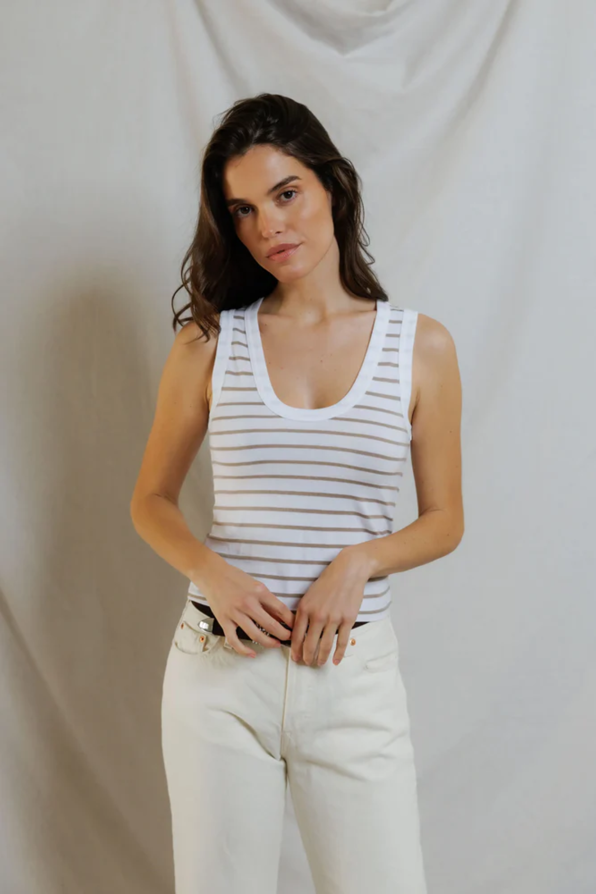 woman in stripe tank on draped background 