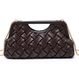 A dark brown woven leather clutch handbag with a gold-tone chain strap, shown against a plain white background.