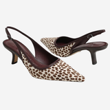 A pair of pointed-toe slingback pumps featuring a brown and beige leopard print pattern with dark brown leather straps and heels, shown against a plain light gray background.