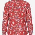 A red long-sleeve western-style shirt with a blue and white floral paisley pattern, featuring a curved blue line detail across the upper back, shown on a light gray background.