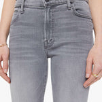 Woman wearing grey straight-leg jeans with a soft, structured fit and clean lines