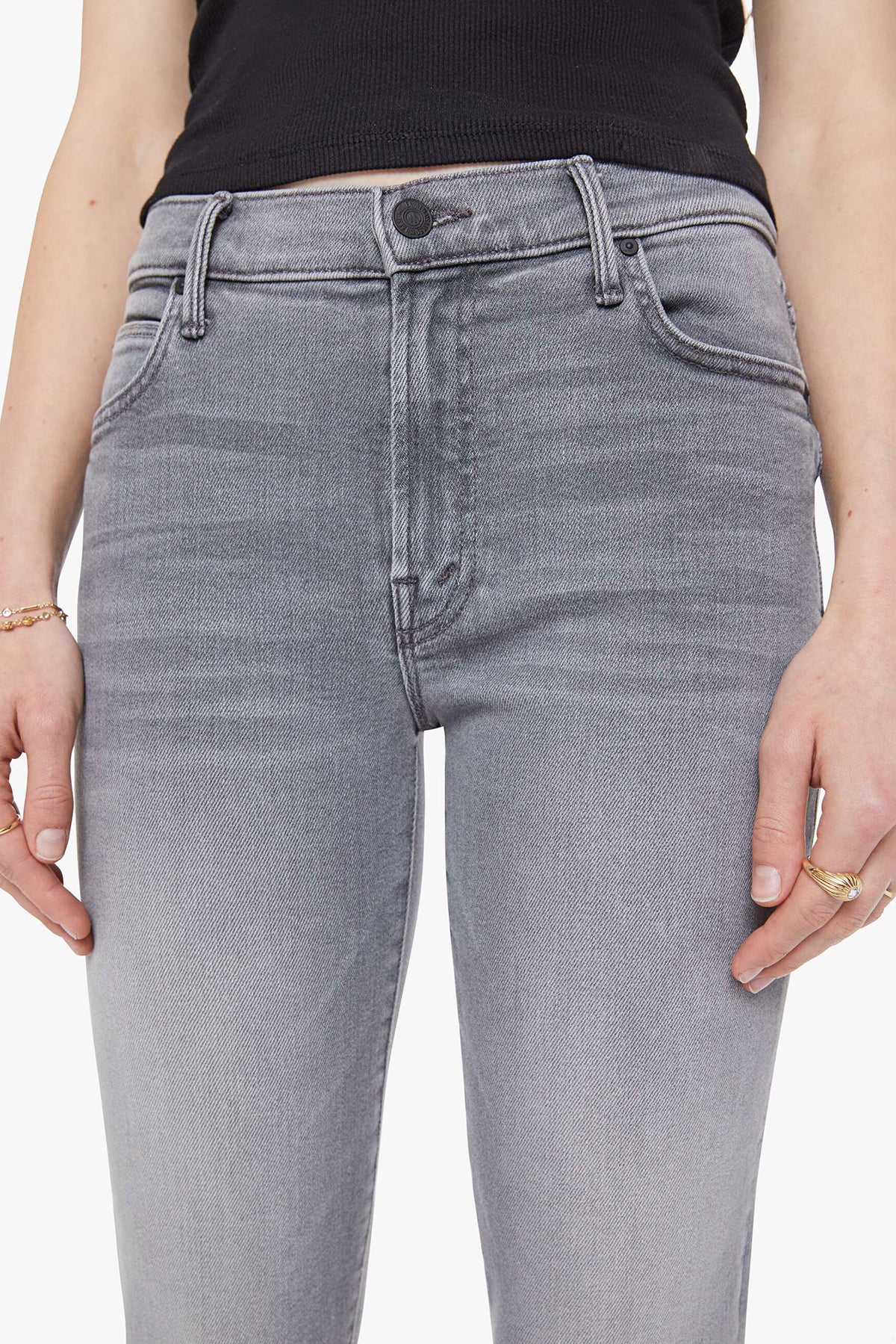 Woman wearing grey straight-leg jeans with a soft, structured fit and clean lines
