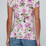 Model wearing rose print tee on a white background.
