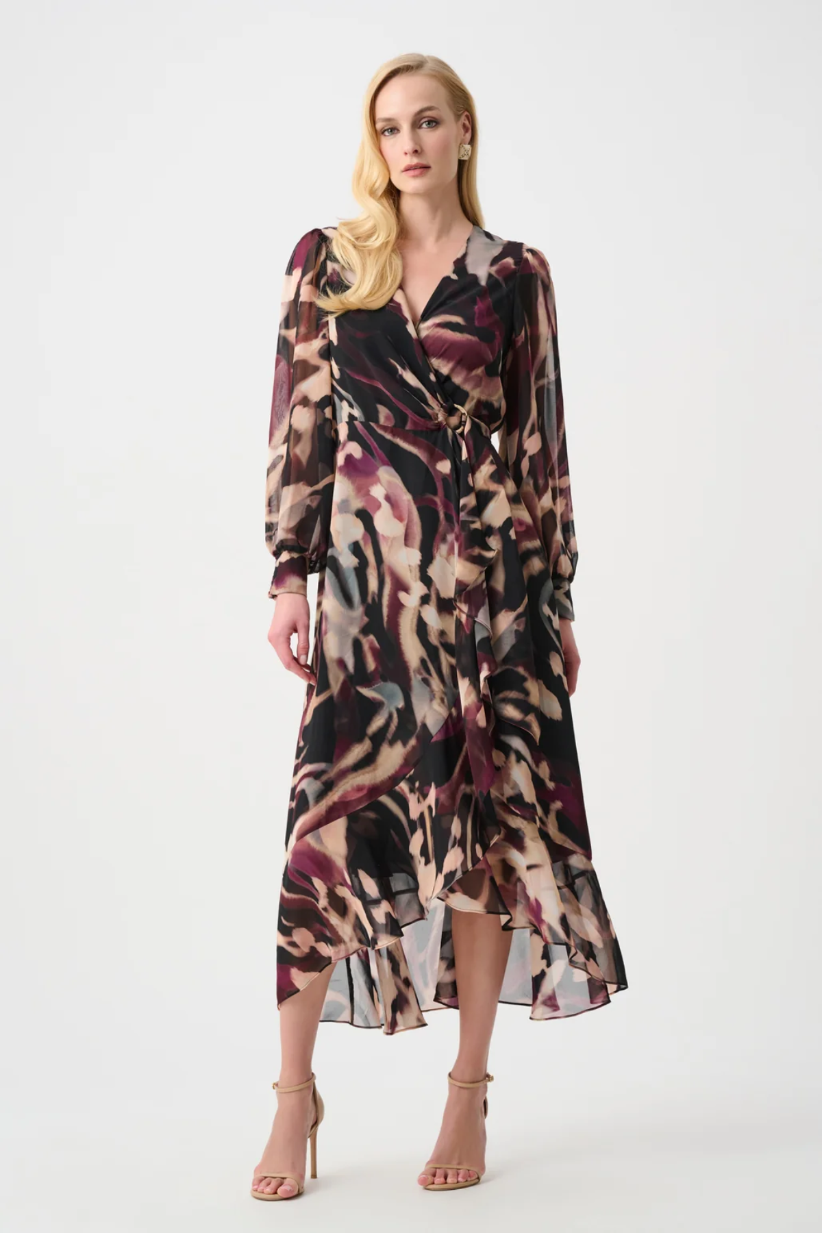Woman wearing a patterned dress on a white background