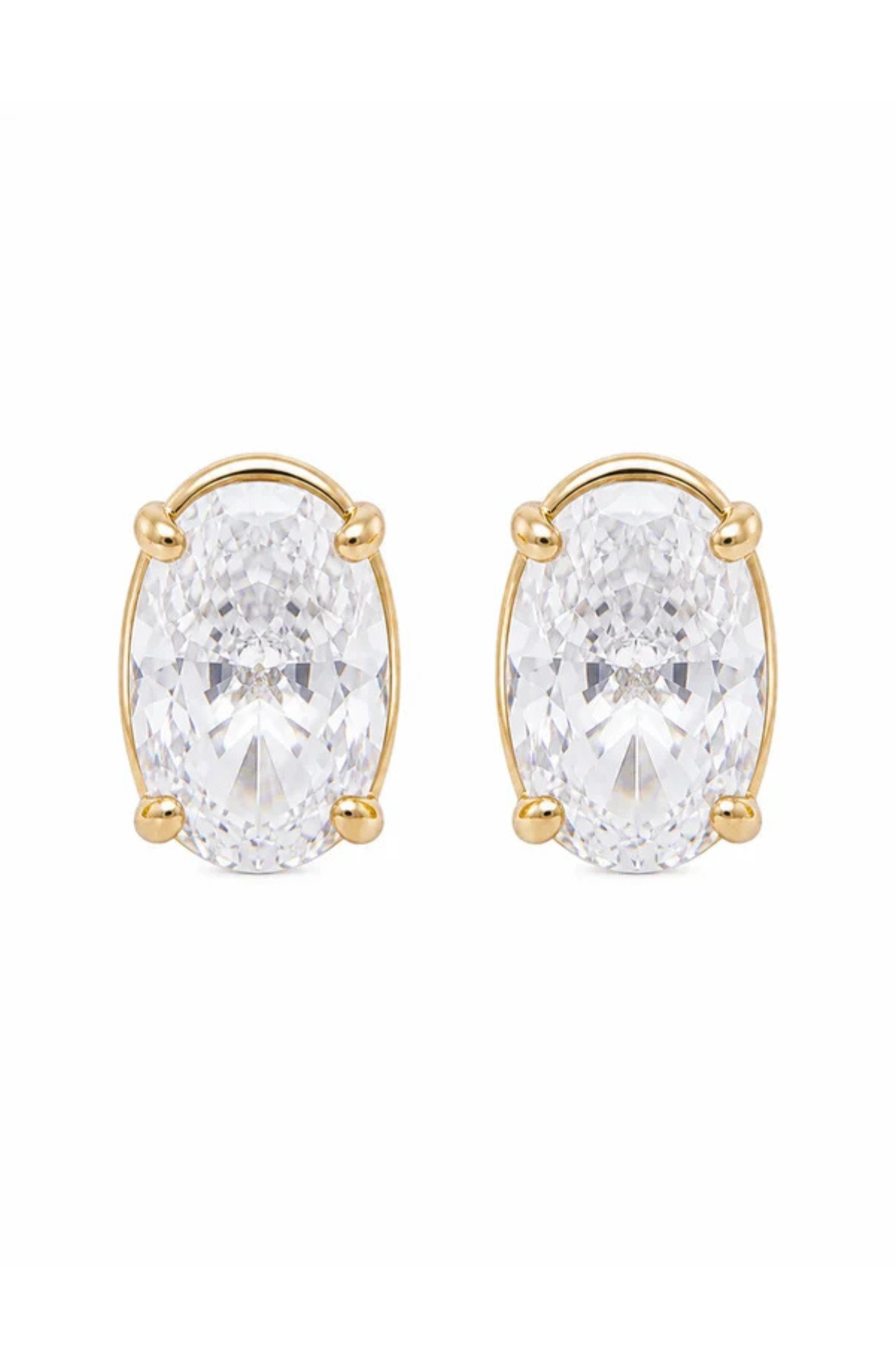 A pair of gold stud earrings featuring large oval-cut clear gemstones in a four-prong setting, shown against a plain white background.