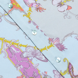 Decorative paper with floral and butterfly pattern on a light blue background