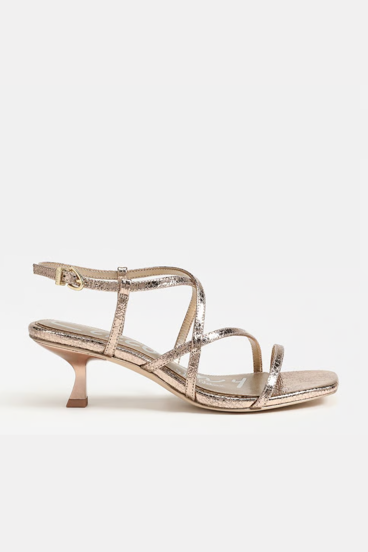 Gold high-heeled sandal on a white background