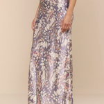 Long floral-patterned dress on a plain background