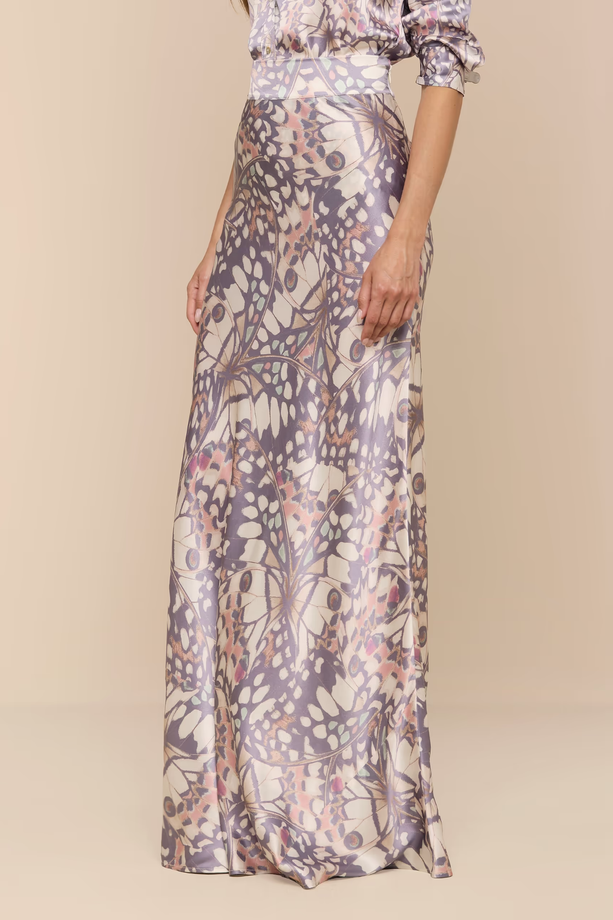 Long floral-patterned dress on a plain background