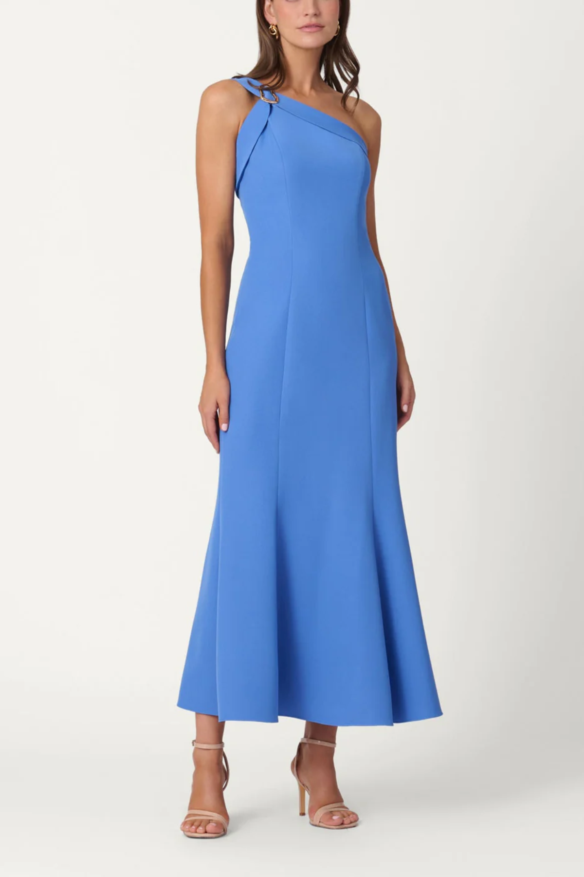 Woman wearing a blue one-shoulder dress on a white background