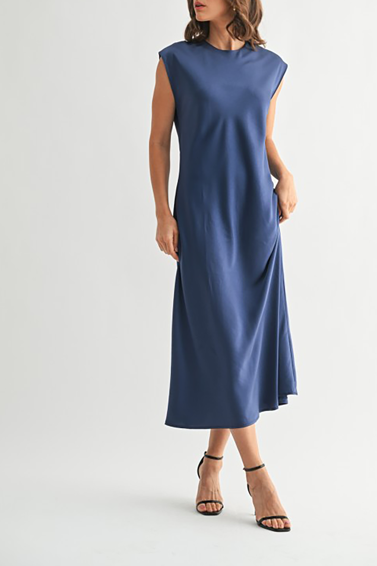 Woman wearing a blue dress on a white background