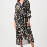 Woman wearing a patterned dress on a white background