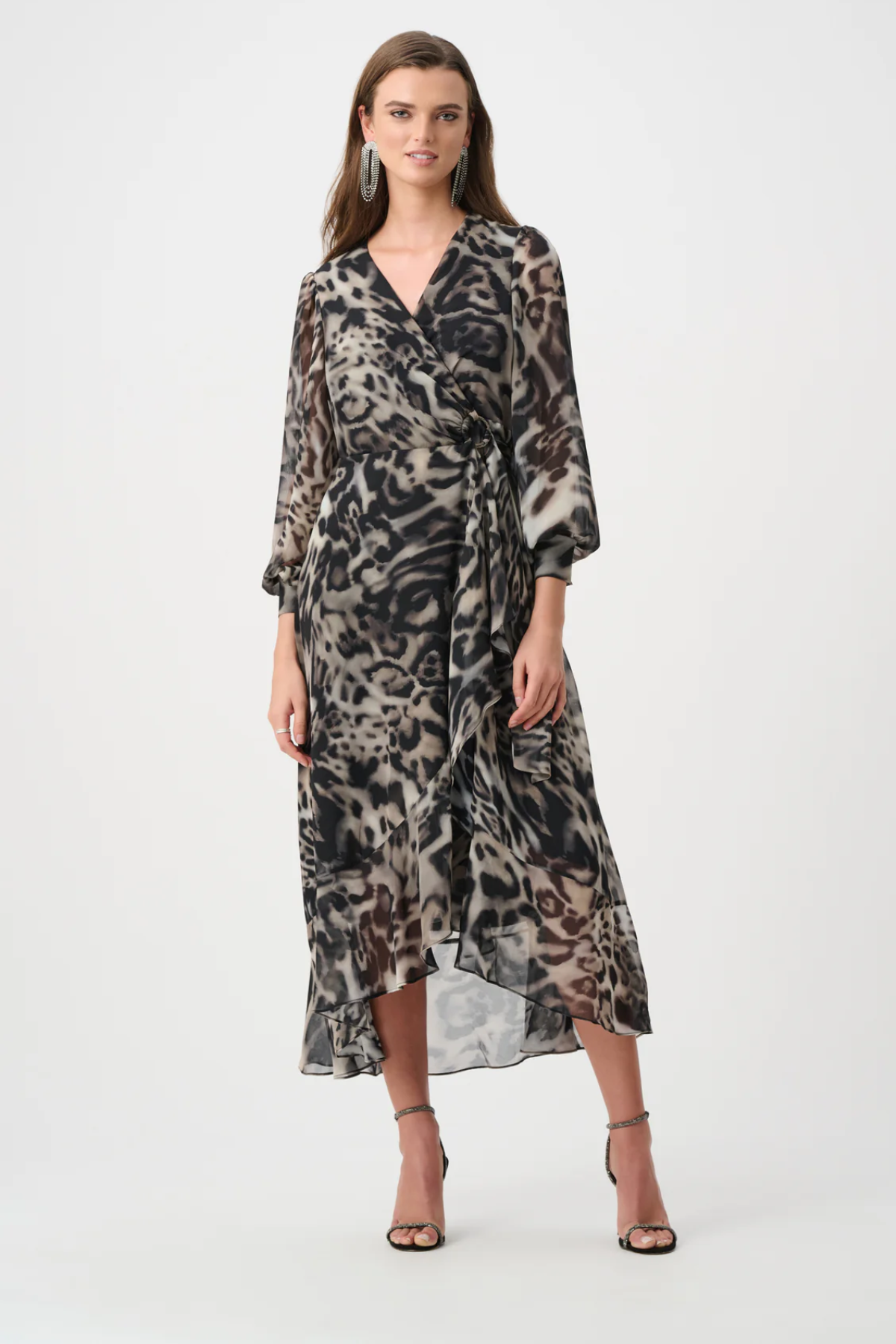 Woman wearing a patterned dress on a white background
